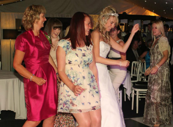 A photo of the bride and gets having fun at the reception